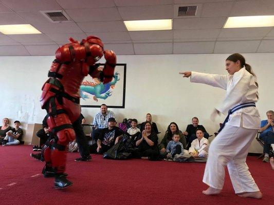 Red Man suit demonstration by Joe and his 12-year-old niece at the Bellflower Martial Arts farewell seminar.