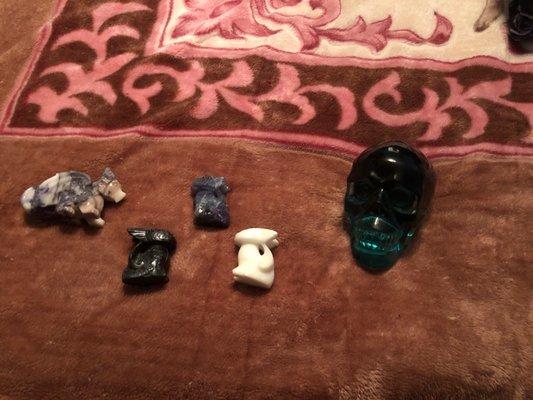 Black obsidian Toothless, White Adventurine Toothless, Rainbow Fluorite Toothless, Tiffany Stone dragon, and Green/Blue Obsidian Skull.