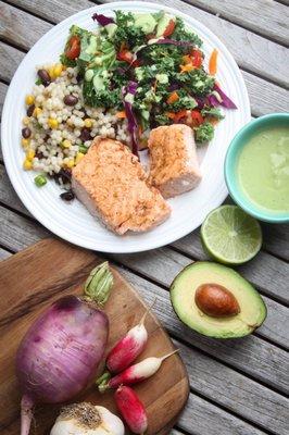 Salmon and israeli couscous, with an avocado lime kale salad