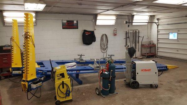 Brand new welder, cutting torch, dent machine, and frame rack.