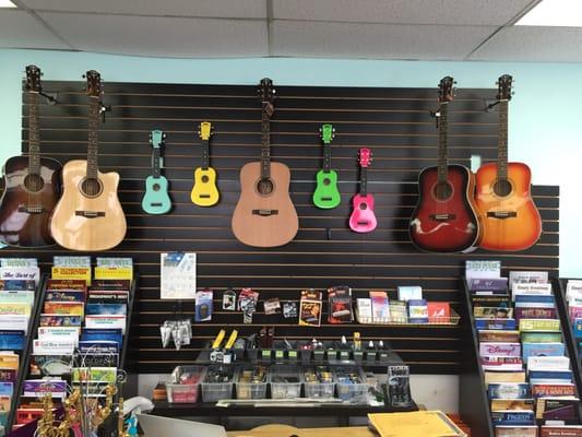 We have plenty of guitars and ukuleles in stock