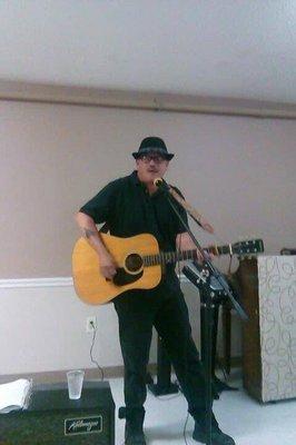 Here's a photo of John playing music at Brookhaven assistant living in Kingsport Tennessee.