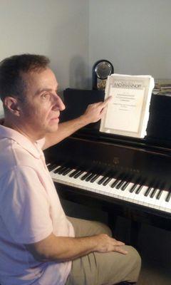 This is Erol seated in front of the Steinway he uses to teach. The Rachmaninoff transcriptions are among his favorites that he plays.