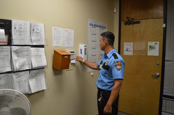 Guard checking the security alarm