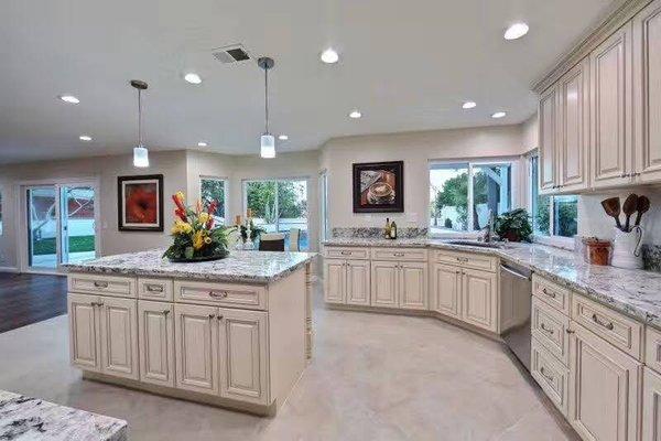 Ivory white kitchen cabinets.