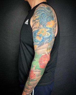 Foo dog with peonies sleeve done by Oliver Wong