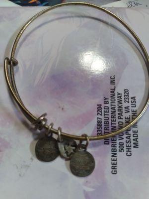 This is how the bracelet looked like after 1 month, no army charm and they get a brass/dirty look to them, I was dissatisfied