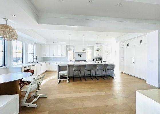 Expansive kitchen, breakfast nook, 9" plank engineered wood flooring and high ceilings with large kitchen island