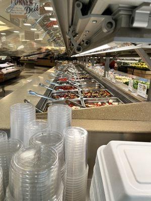 More salad bar with olives and pickled veggies