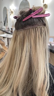 One row of hand sewn Easi Hair Pro extensions