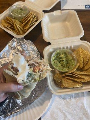 Chicken, bean + cheese taco W/ Lettuce, tomato sour cream (on side) Fresh guacamole w/cilantro + tortilla chips.