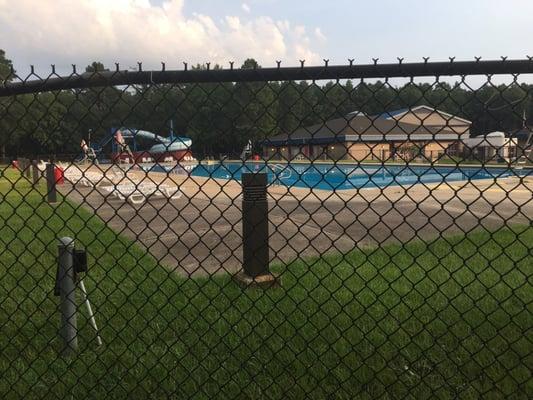 The pool is secure by this large fence.