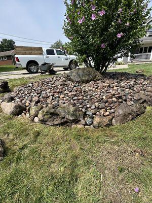 River Rock bed Installation with weed control liner.