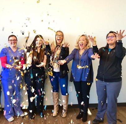 The team celebrating one year serving our incredible patients in Jenks, OK!