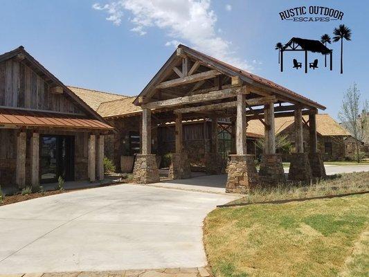 This is a pavilion we built that is used as a porte cochere.  We built this and many other features on this home using reclaimed wood.