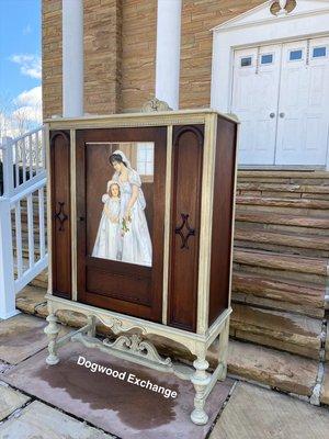 Recycled art work featured on a rehabbed China cabinet