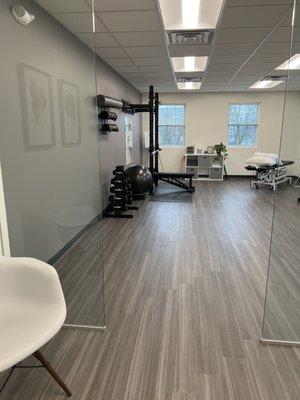 Our open concept gym allows for a spacious healing environment