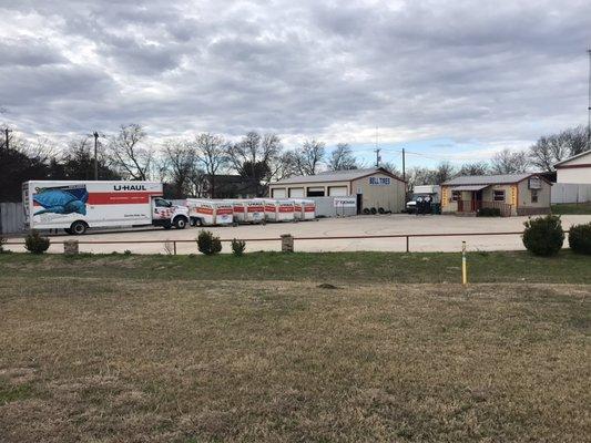 Street view of U-Haul equipment in front parking lot.