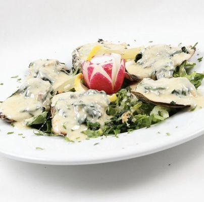 Maria's Oysters ; broiled then topped with fresh sautéed spinach & parmesan cream sauce