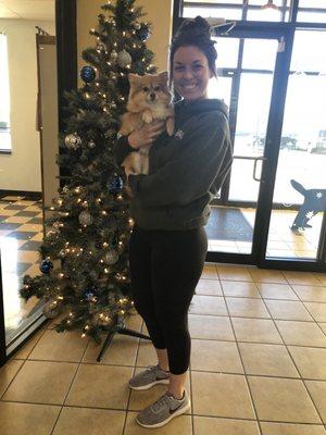 The manager Lindsey holding my baby while she decorated the Christmas tree!