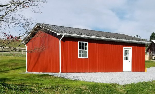 One-car garage built in 2017 in PA. Burnished Slate roof, Red siding, Bright White trim, snow guards, and carriage style doors.