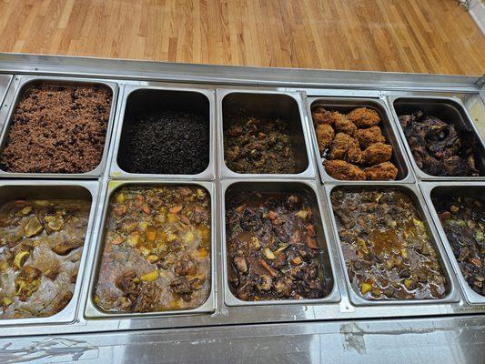 Our options: Rice and Peas, Haitian Black Rice, Stewed and Fried Chicken, Jerk Chicken, Curry Goat, stew chicken, Oxtails and much more.