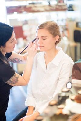 Keely applying makeup for a beautiful bride.