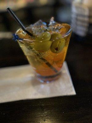 Whiskey Old Fashioned Press with Olives.