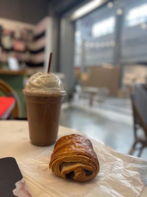 Iced cold brew with chocolate and a pain au chocolat