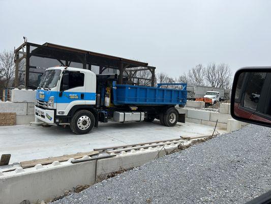 Smaller cans for concrete and clean fill.