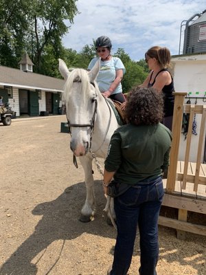 Izzy the horse, Elliot the volunteer, Miss Jessica and me on Izzy