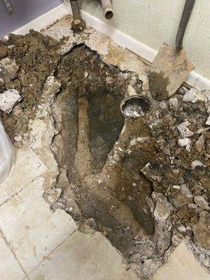 Dug up collapsed drainpipe- laundry room; BEFORE