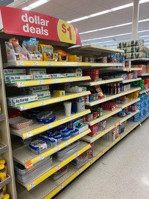 Dollar Deal section inside Walgreens, has sandwich bags, trash bags, plastic containers, pet food, and others