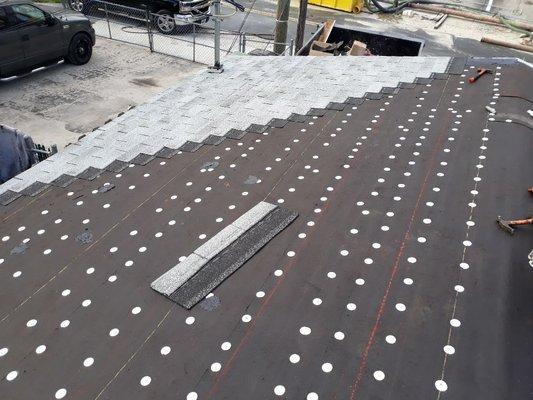 Installing the shingle in progress for the city to inspect.