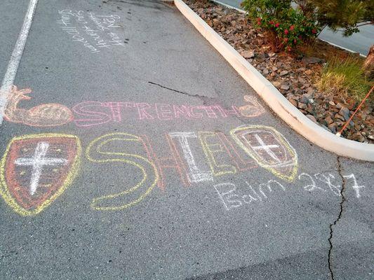 The Rock Youth Group decided to "tag up the parking lot with their favorite verses and song lyrics.