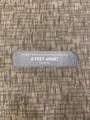 Social distancing floor signs