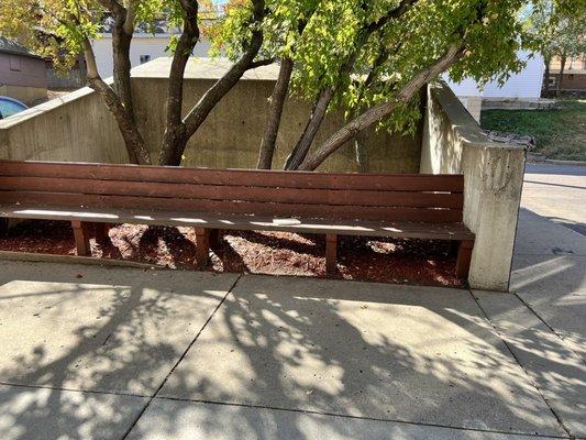 Outdoor seating near back of building (near parking lot