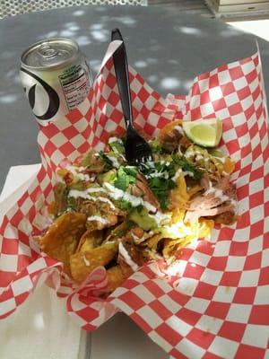 Lunch = mini carnitas nachos and Diet Coke for $8.50...yum!