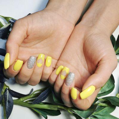 Bright yellow nails with a glossy finish. Perfect for a sunny, cheerful look