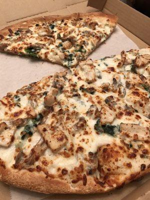 We got chicken Alfredo with spinach and mushrooms , this is my new favorite pizza place . It's so good