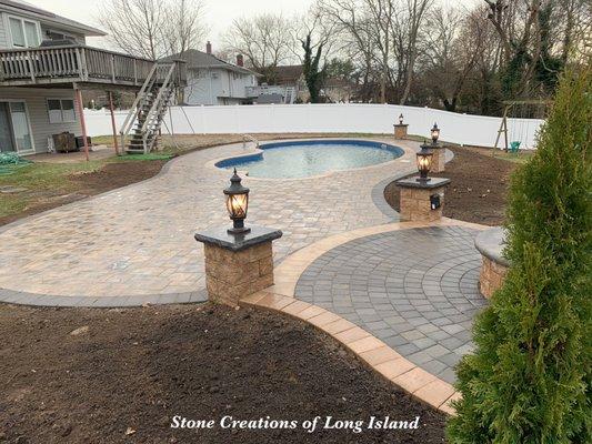 Poolscapes with light columns and stone caps