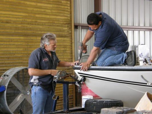 Lewis and Jose working on a customers boat