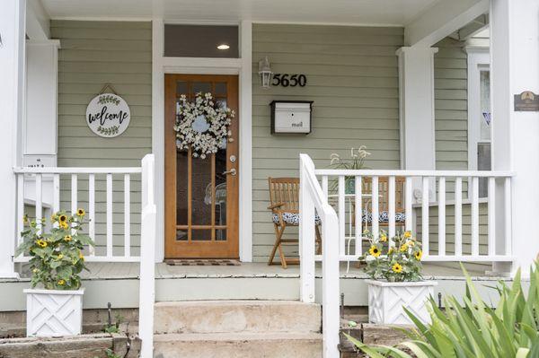 Adorable and welcoming front porch.