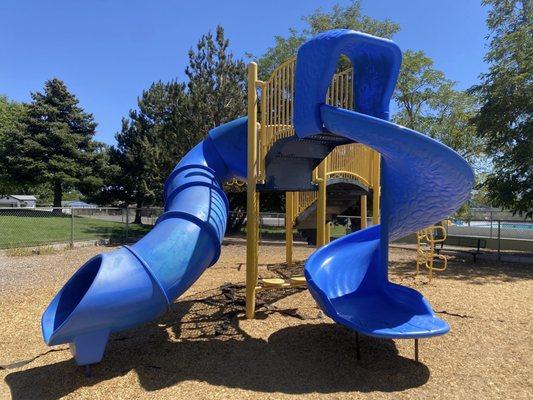 The slides on the bigger playground.