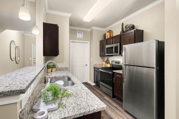 Kitchen with stainless steel appliances at Estancia at Ridgeview Ranch