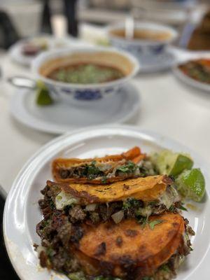 Cheese tacos with asada, bowl of birria