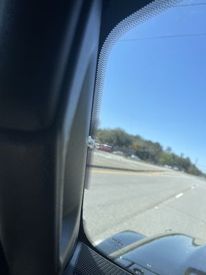 Weird bullet hole crack in windshield