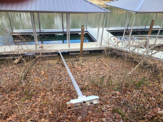 That tree trunk twisting the dock is a whole tree. So I was not able to pull it out - with a large come along.