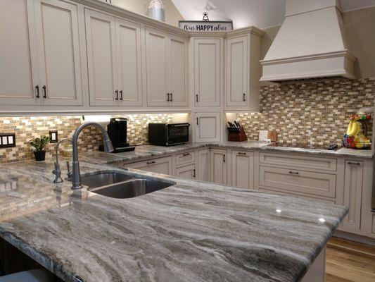 Brentwood Maple from Omega Cabinetry with Fantasy Brown countertops.