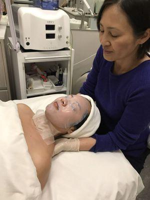 Having a neck and shoulder massage while the marine-collagen mask is hydrating and pumping the skin.